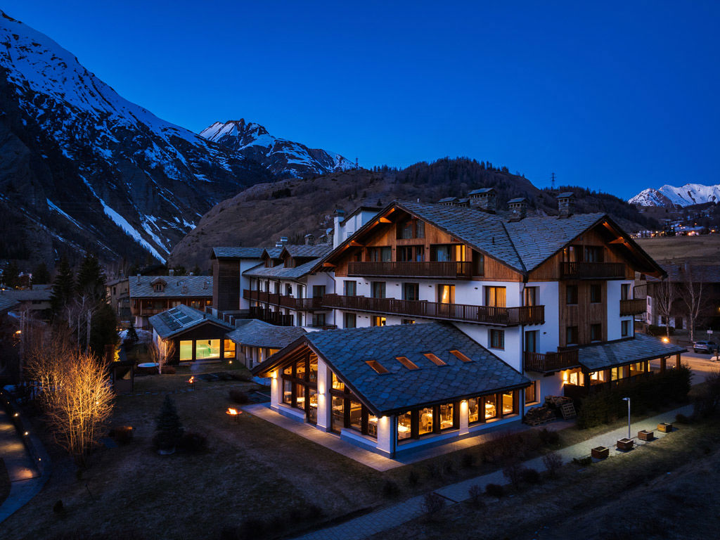The Montana Lodge & Spa, by R Collection Hotels in La Thuile, Italy, designed with an Alpine architecture and situated within the snowy mountains.