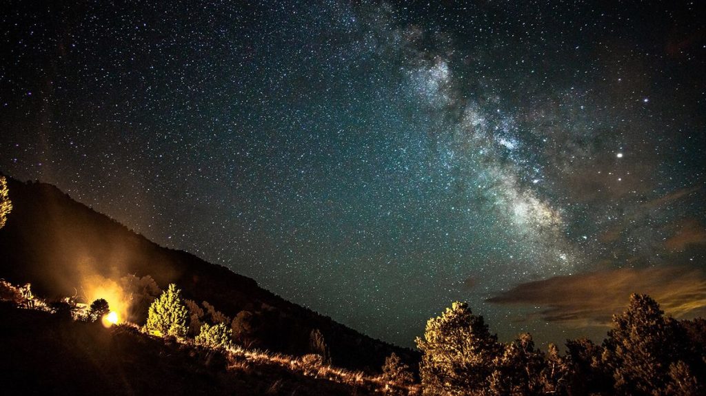 A view of the Milky Way galaxy against a dense starfield, captured from a remote area with low light pollution in the Massacre Rim Dark Sky Sanctuary in Nevada.