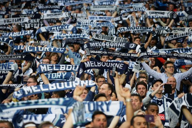 Melbourne fans holding up match scarves at the A-League Grand Final.