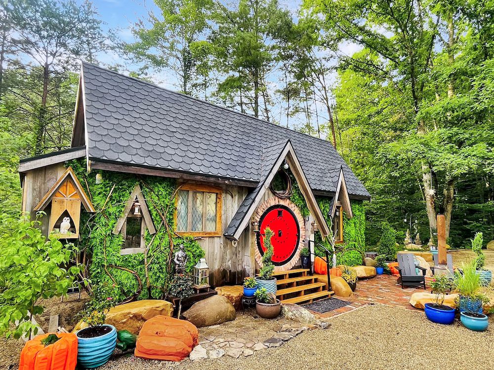 The "Magical Wizarding House" at Mountain Shire in Sevierville, Tennessee, featuring a distinctive round red door and magical touches.