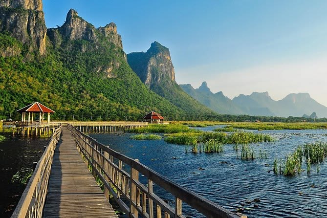 A wooden boardwalk spans the Bueng Bua Wetlands inside Khao Sam Roi Yot National Park in Prachuap Khiri Khan, Thailand.