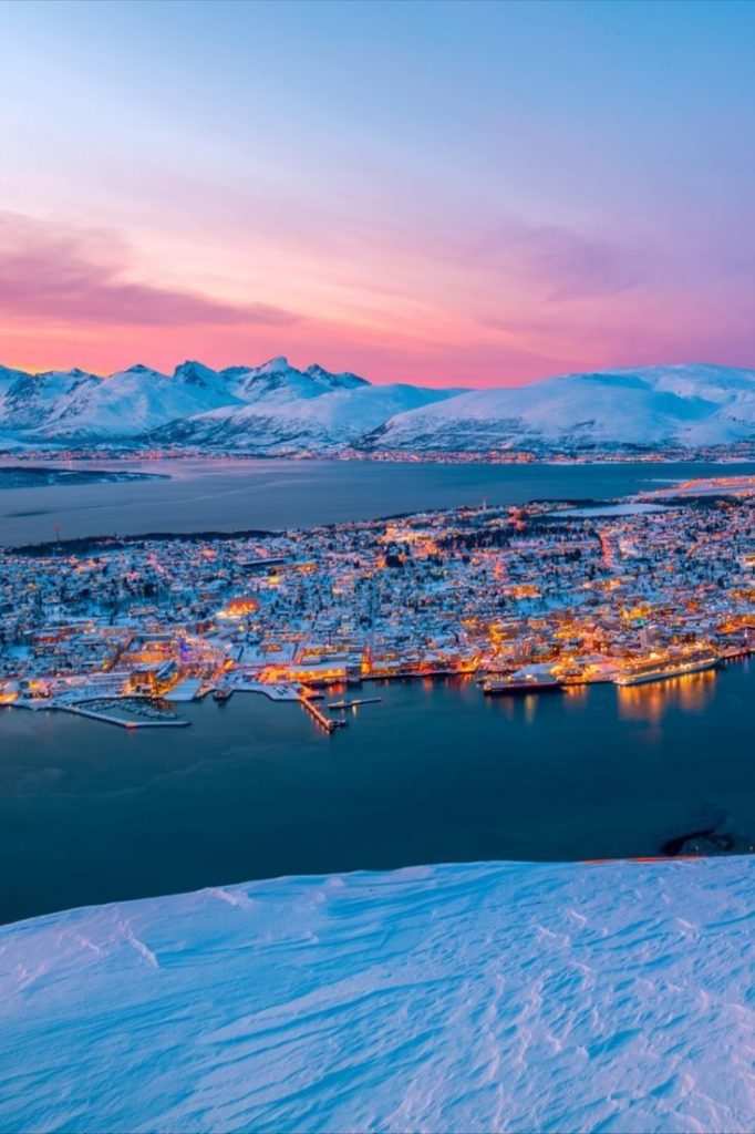 An aerial view of Tromsø, known as Norway's "Paris of the North," during the sunset.